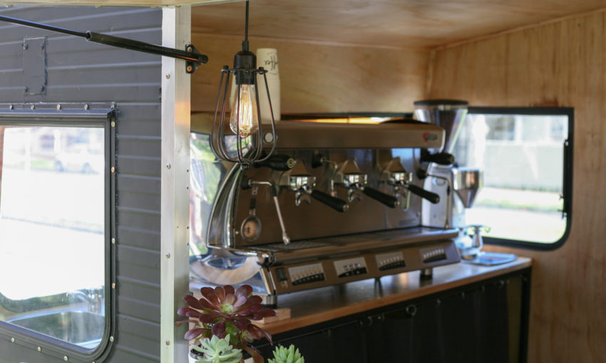 Barista serving coffee at a live event bar