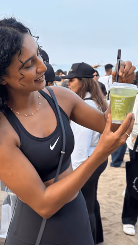 An AB Coffee guest with a drink